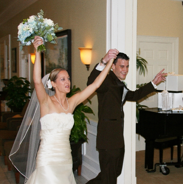 Laura and Adam enter the hall