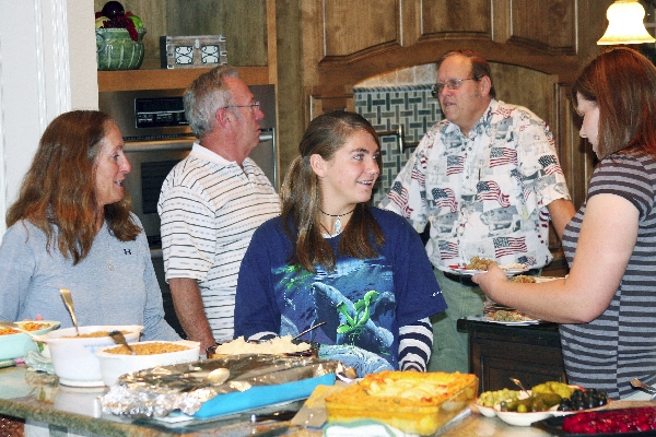 Loading up plates of food