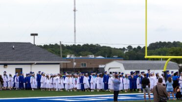 20250530_165106960 Graduates lining up for the processional