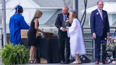 20250530_180756780 Receiving her diploma